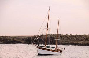 Sailing boat in the bay photo