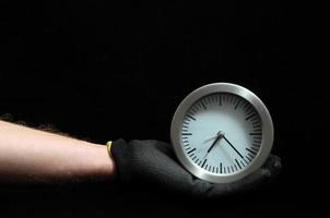 Hand holding a clock photo