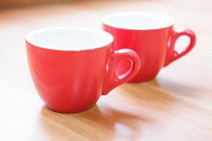 a pair of pretty red glass mugs photo