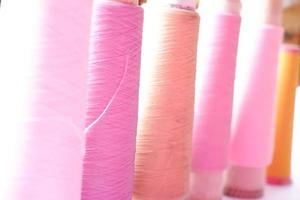 various colors of sewing thread photo