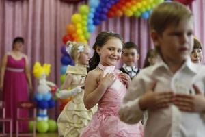 Belarus, city of Gomil, May 16, 2019. Morning in kindergarten.A group of children at a matinee in kindergarten. photo