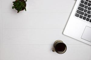 Laptop on table, top view, copy space photo