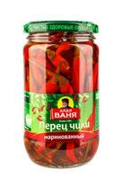 KRASNOYARSK, RUSSIA - NOVEMBER 07, 2022 Glass jar with pickled peppers isolated on white photo