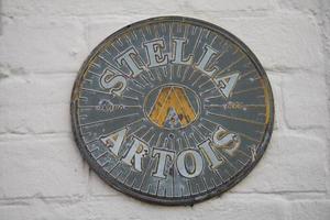 LINDFIELD, WEST SUSSEX, UK - FEBRUARY 01. View of the Stella Artois sign outside the Bent Arms pub in the village of Lindfield West Sussex on February 01, 2023 photo