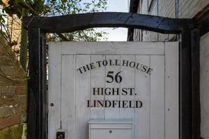 LINDFIELD, WEST SUSSEX, UK - FEBRUARY 01. View of a wooden gate at the old toll house building in the village of Lindfield West Sussex on February 01, 2023 photo