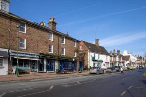 LINDFIELD, WEST SUSSEX, UK - FEBRUARY 01. View of historical buildings in the village of Lindfield West Sussex on February 01, 2023. Four unidentifed people photo