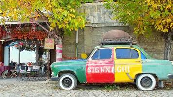 Sighngahi, Georgia, 2022 - old retro car with Sighnaghi town name written stand by house. Popular travel destination in Georgia, Kakheti video