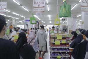 Abstract blurred of isle interior in a market, with bokeh light background. photo