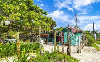 Tropical natural beach palm tree hut Playa del Carmen Mexico. photo