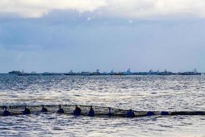 Boats yachts ship jetty beach in Playa del Carmen Mexico. photo