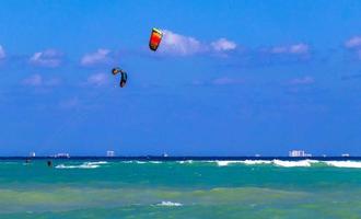 Water sport like kitesurfing kiteboarding wakeboarding Playa del Carmen Mexico. photo