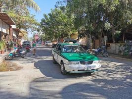 Puerto Escondido Oaxaca Mexico 2023  Green colorful taxi cab car in Puerto Escondido Mexico. photo