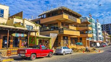 Puerto Escondido Oaxaca Mexico 2023 Scenic view tourist street palm city Zicatela Puerto Escondido Mexico. photo