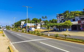 Puerto Escondido Oaxaca Mexico 2023 Busy road street driving cars traffic jam Puerto Escondido Mexico. photo