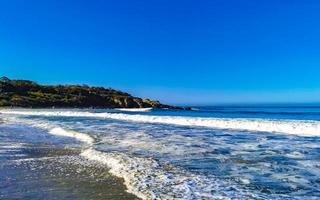 Extremely huge big surfer waves beach La Punta Zicatela Mexico. photo