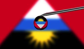 Vaccine syringe with drop on needle against national flag of Antigua and Barbuda background. Medical concept vaccination. Coronavirus Sars-Cov-2 pandemic protection. National safety idea. photo