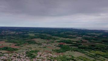 Drone video of the Istrian coast in front of Porec taken from high altitude in the afternoon with cloudy sky