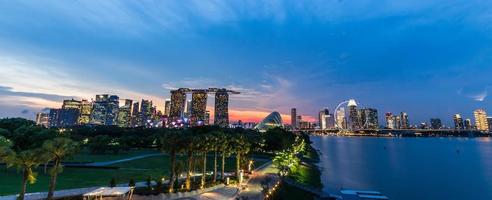 Singapore skyline cityscape and sunset on marina bay in twilight time . Panoramic view . Taken photo on marina barrage .