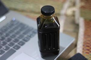 A bottle of soy sauce on the table photo