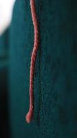 Close up of red and white rope on blue background. Selective focus. photo