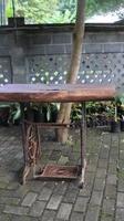Old rusty wooden table in the garden, selective focus. photo