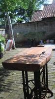 Old rusty wooden table in the garden, selective focus. photo