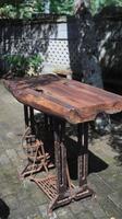 Old rusty wooden table in the garden, selective focus. photo