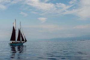 boat sailing sail ship in the blue sea photo