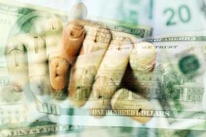 wooden hand holding dollars close up detail macro photo