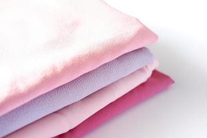 various beautiful and attractive fabrics folded neatly photo