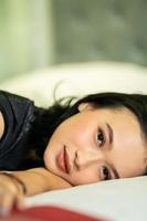 Indonesian women sleeping alone in her bad and she have a black hair photo