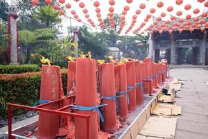 Bandung City, Indonesia, 2022 - The Architecture of the Buddha Temple with Chinese ornament like red colors amazes the Buddhist people while praying photo