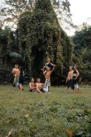 Indonesian dancers pose with their bodies while wearing a traditional golden costume from Javanese photo