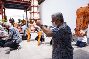 Bandung City, Indonesia, 2022 - Buddhist community praying together with the monks in front of the altar photo