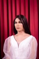 Luxury Asian woman in a white dress with a red curtain in the background photo