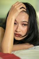 Asian Women being stressed while thinking about breaking up photo