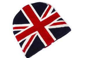 Winter knitted hat with UK flag pattern on white background photo