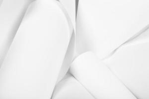 White sheets of office paper are twisted and scattered. Paper white abstract background. photo