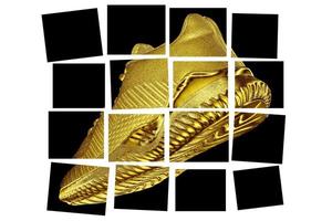 Golden creative sneaker divided into squares.Abstract golden shoes. photo