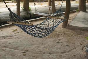 Hammock hanging from a tree for sleeping photo