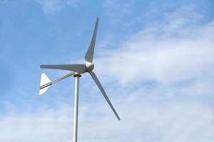 Wind Turbine Generating Electricity Blue Sky Background photo