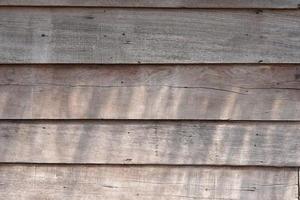 Old wooden background with cracks from time gone by. photo