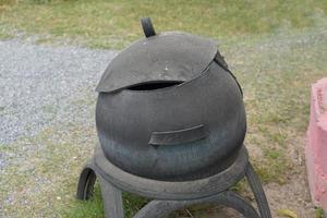 Trash can made from old car wheels photo