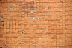 row of brown brick wall background photo