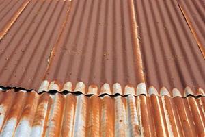 The tin roof background with the rust and nails hole by vintage style. photo