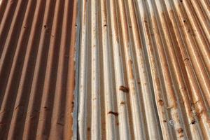 The tin roof background with the rust and nails hole by vintage style. photo