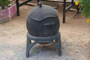 Trash can made from old car wheels photo