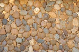 fondo de pared de piedra en jardín de flores foto