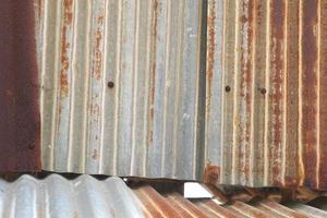 The tin roof background with the rust and nails hole by vintage style. photo