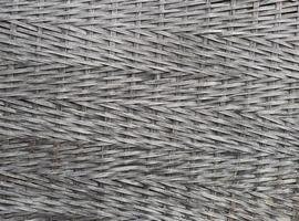 Black woven wood texture background.Dark weave bamboo wood texture photo